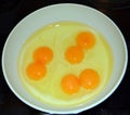 Three eggs with double yolk