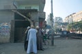 Three Egyptian men chatting on the dusty streets of Cairo, Egypt