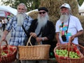 Three elderly farmers on Apple Savior Feast - Eastern Slavic folk holiday and most important of the three Saviour Spas days