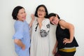 Three elderly women standing and laughing together Royalty Free Stock Photo