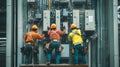 Three Electricians Working on a Building\'s Electrical System Royalty Free Stock Photo