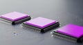 Three electronic microprocessors with purple heat spreaders on a dark surface Royalty Free Stock Photo