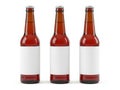 Three empty amber beer bottles with blank labels Royalty Free Stock Photo