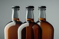 Three empty beer bottles arranged neatly on a table, suitable for use in advertising or editorial content Royalty Free Stock Photo