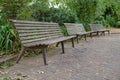 Three empty benches in a London park Royalty Free Stock Photo