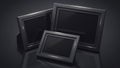 Three empty black picture frames on a dark reflective surface Royalty Free Stock Photo