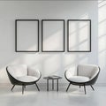 Three empty black picture frames on the wall of an allwhite room with two modern armchairs simple and minimalistic Royalty Free Stock Photo
