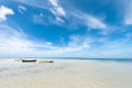 Three empty boats in low tide of Indian Ocean. Seychelles, Mahe island. Royalty Free Stock Photo