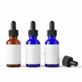 Three empty bottles with droppers for essential oils on a white background Royalty Free Stock Photo