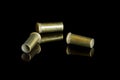 Three empty cartridges of small caliber bullets Royalty Free Stock Photo