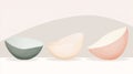 Three empty ceramic bowls of different colors and slightly tilted positions create a modern and minimalist still life composition Royalty Free Stock Photo