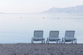 Three empty deck chair on the beach Royalty Free Stock Photo