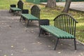 Empty green wooden benches in the autumn park Royalty Free Stock Photo