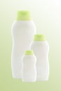 Three empty light-green bottles. Isolated Royalty Free Stock Photo