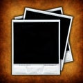 Three empty photo frames over grunge background Royalty Free Stock Photo