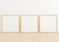 Triple 10x10 Square Wood Frame mockup on wooden floor and white wall