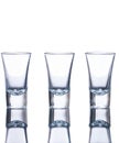 Three empty shot glasses