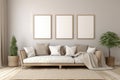 Three empty vertical picture frames in a modern living room with neutral grey sofa, pillows and plants. Wall art mockup Royalty Free Stock Photo