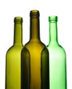 Three empty wine bottles for recycling