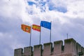 European union and aragon spain flags against the sky on a stone historic castle Royalty Free Stock Photo