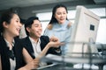 Three excited employees reading good news on line in a computer desktop at office Royalty Free Stock Photo