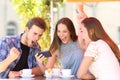 Excited friends celebrating good news watching phone content Royalty Free Stock Photo