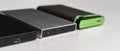 the three external hdd drives one the shelf, data backup storage