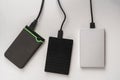 the three external hdd drives one the shelf, data backup storage
