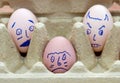 Three face painted eggs Royalty Free Stock Photo