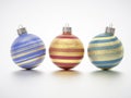 Three fancy Christmas balls on light grey studio background