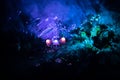 Three fantasy glowing mushrooms in mystery dark forest close-up. Beautiful macro shot of magic mushroom or three souls lost in ava Royalty Free Stock Photo