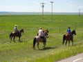 Cowboys rounding up cattle as seen from the road in wyoming