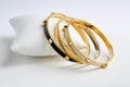 Three Fashion Women's Bracelets Gold Tone Black White Enamel Royalty Free Stock Photo