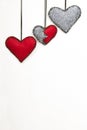 Three felt heart on a white background,