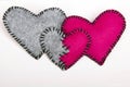 Three felt hearts on a white wooden background Royalty Free Stock Photo