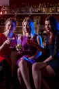 Three female friends in bar Royalty Free Stock Photo