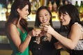 Three Female Friends Enjoying Drink In Cocktail Bar Royalty Free Stock Photo