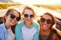 Three Female Friends On Road Trip In Back Of Convertible Car Royalty Free Stock Photo