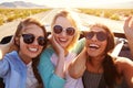 Three Female Friends On Road Trip In Back Of Convertible Car Royalty Free Stock Photo