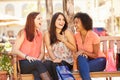 Three Female Friends With Shopping Bags Sitting In Mall Royalty Free Stock Photo