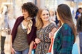 Three Female Friends Shopping In Mall Together Royalty Free Stock Photo