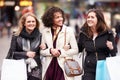 Three Female Friends Shopping Outdoors Together Royalty Free Stock Photo