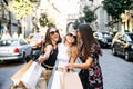 Three female friends walk after shopping Royalty Free Stock Photo