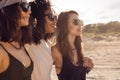 Three female friends walking on the beach