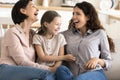 Three female generations family laughing enjoy carefree leisure at home Royalty Free Stock Photo