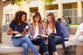 Three Female High School Students Working On Campus Royalty Free Stock Photo