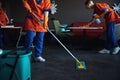 Three female janitors in rubber gloves doing the wet cleaning Royalty Free Stock Photo