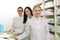 Three female pharmacists on work Royalty Free Stock Photo