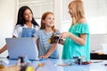 Three Female Students Building And Programing Robot Vehicle In After School Computer Coding Class Royalty Free Stock Photo