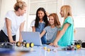 Three Female Students With Teacher Building Robot Vehicle In After School Computer Coding Class Royalty Free Stock Photo